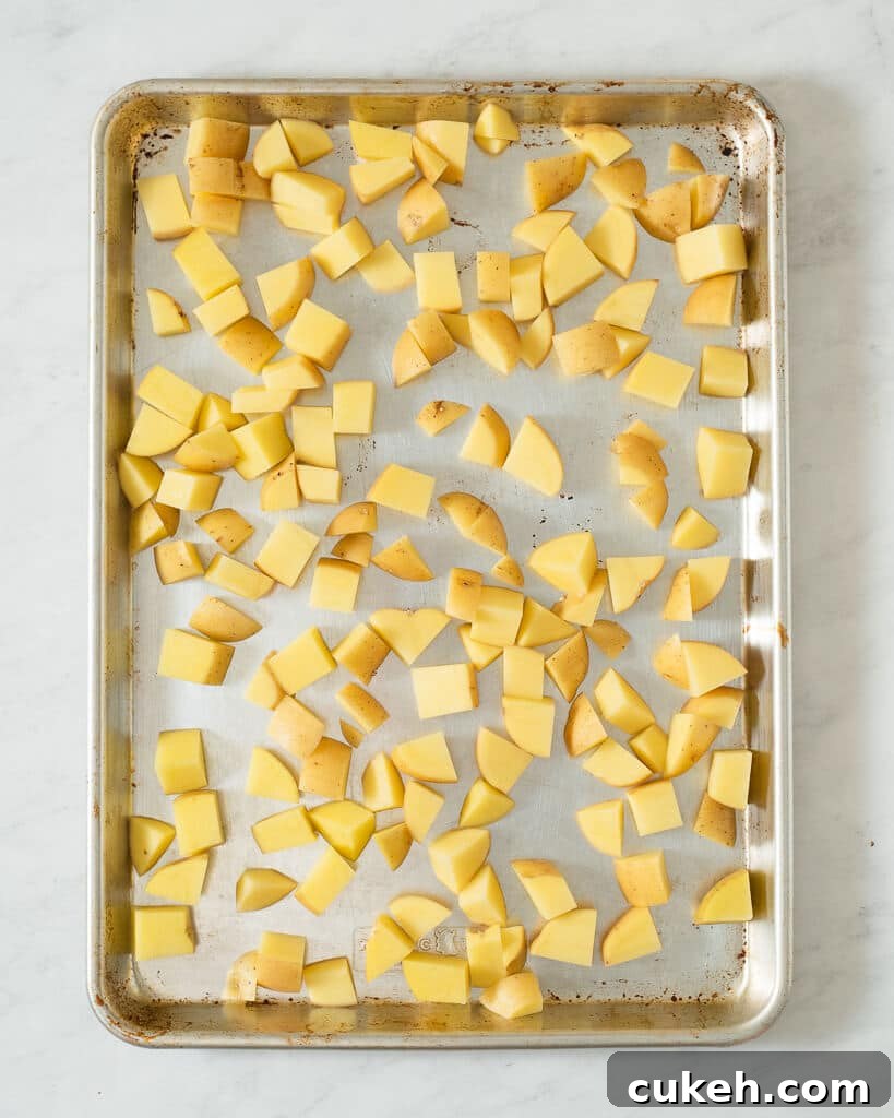 a sheet pan of cubed potatoes