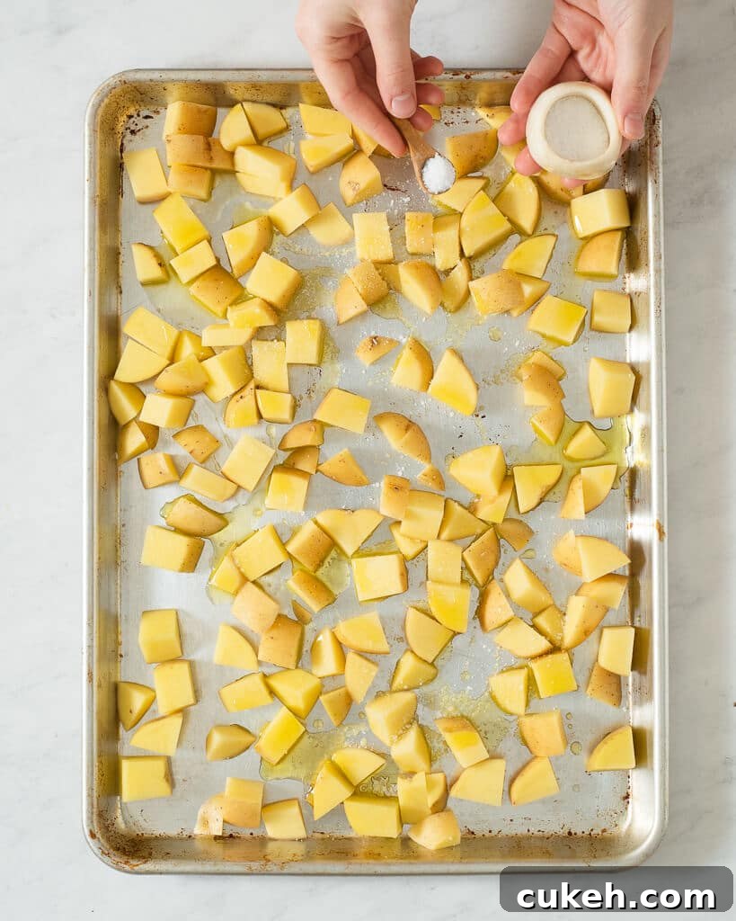 a sheet pan of cubed potatoes