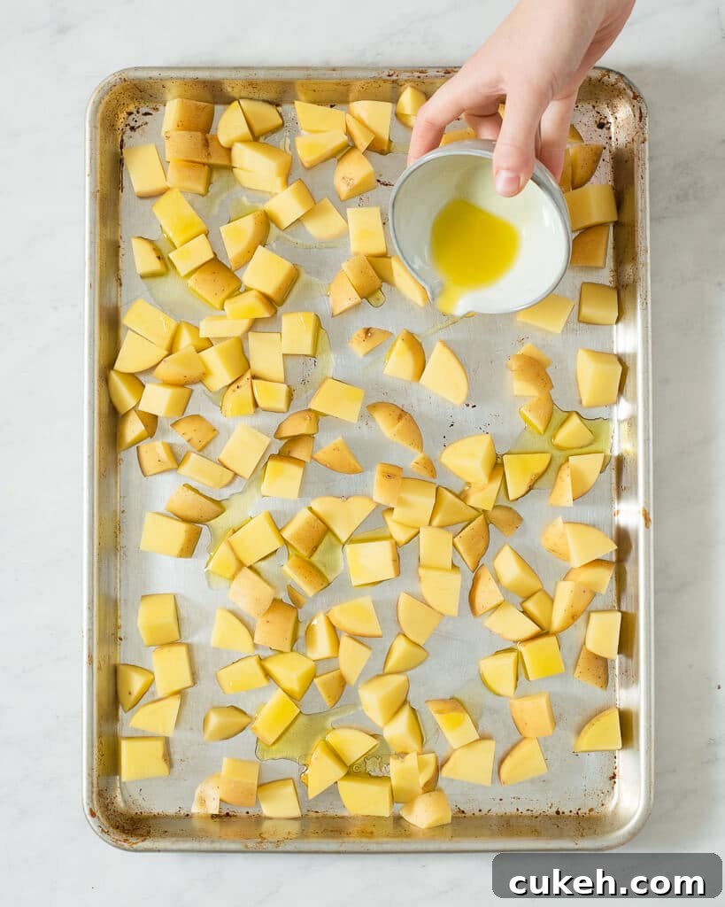 a sheet pan of cubed potatoes