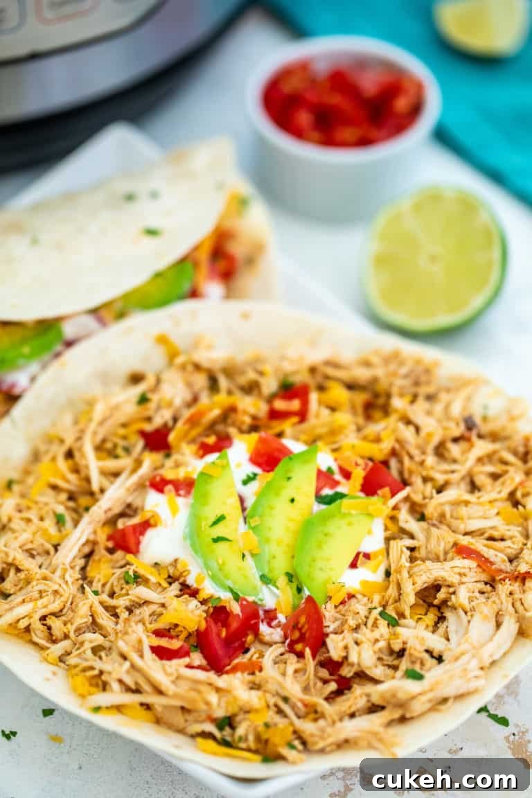 Instant Pot Chicken Fajitas — Quick Weeknight Recipe (Video) 3 one assembled pressure cooker chicken fajita with lime and salsa on a wrap