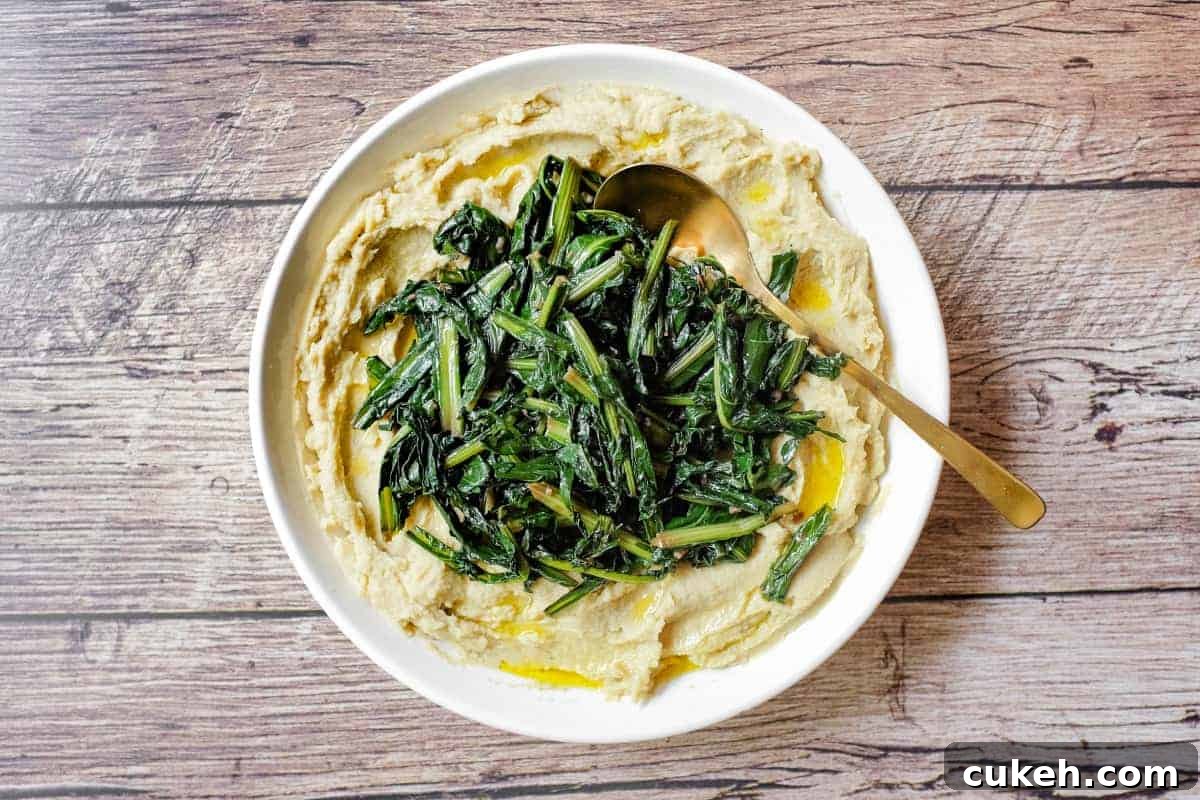 A large platter of fava bean puree (fave e cicoria) with sauteed chicory