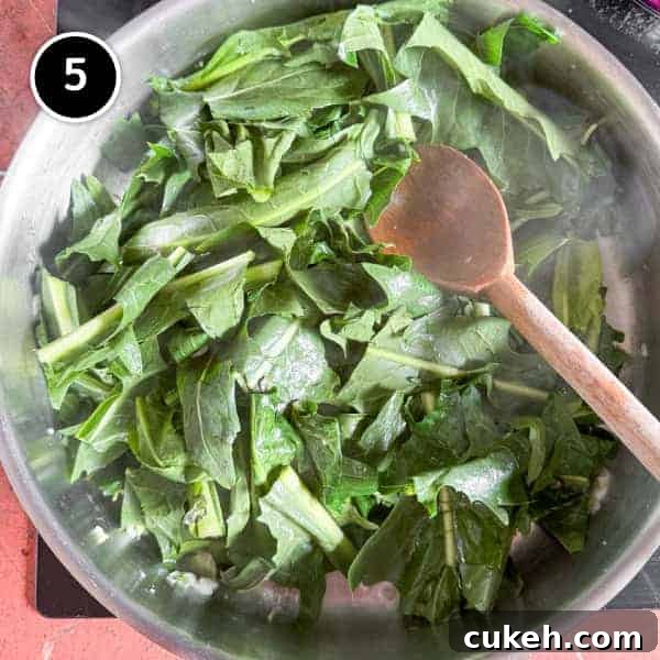 Chicory leaves in a frying pan with garlic.