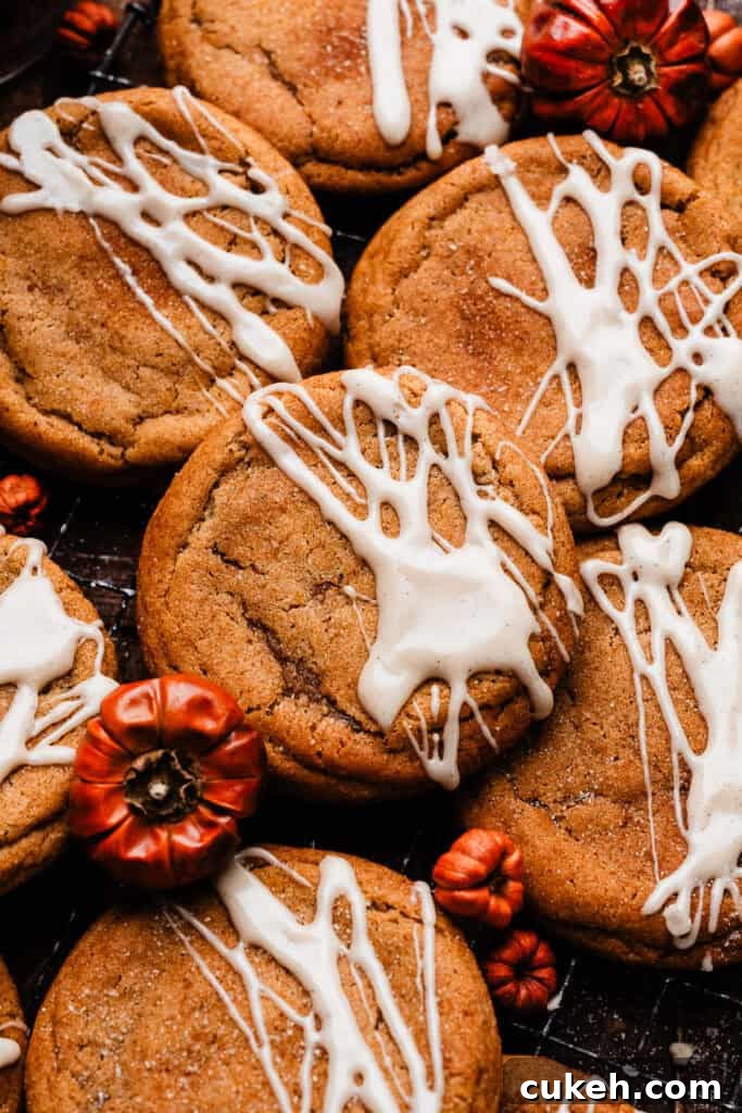 Chewy pumpkin cookies with a maple glaze drizzle.