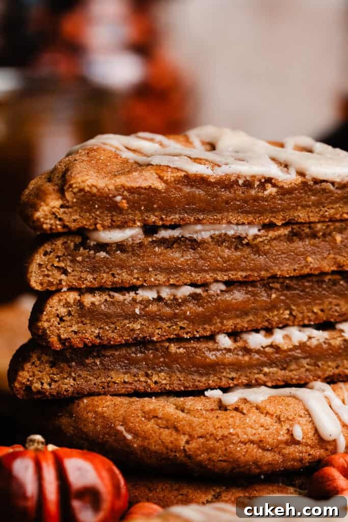 A close-up on a stack of cookie halves, showing the chewy texture inside.
