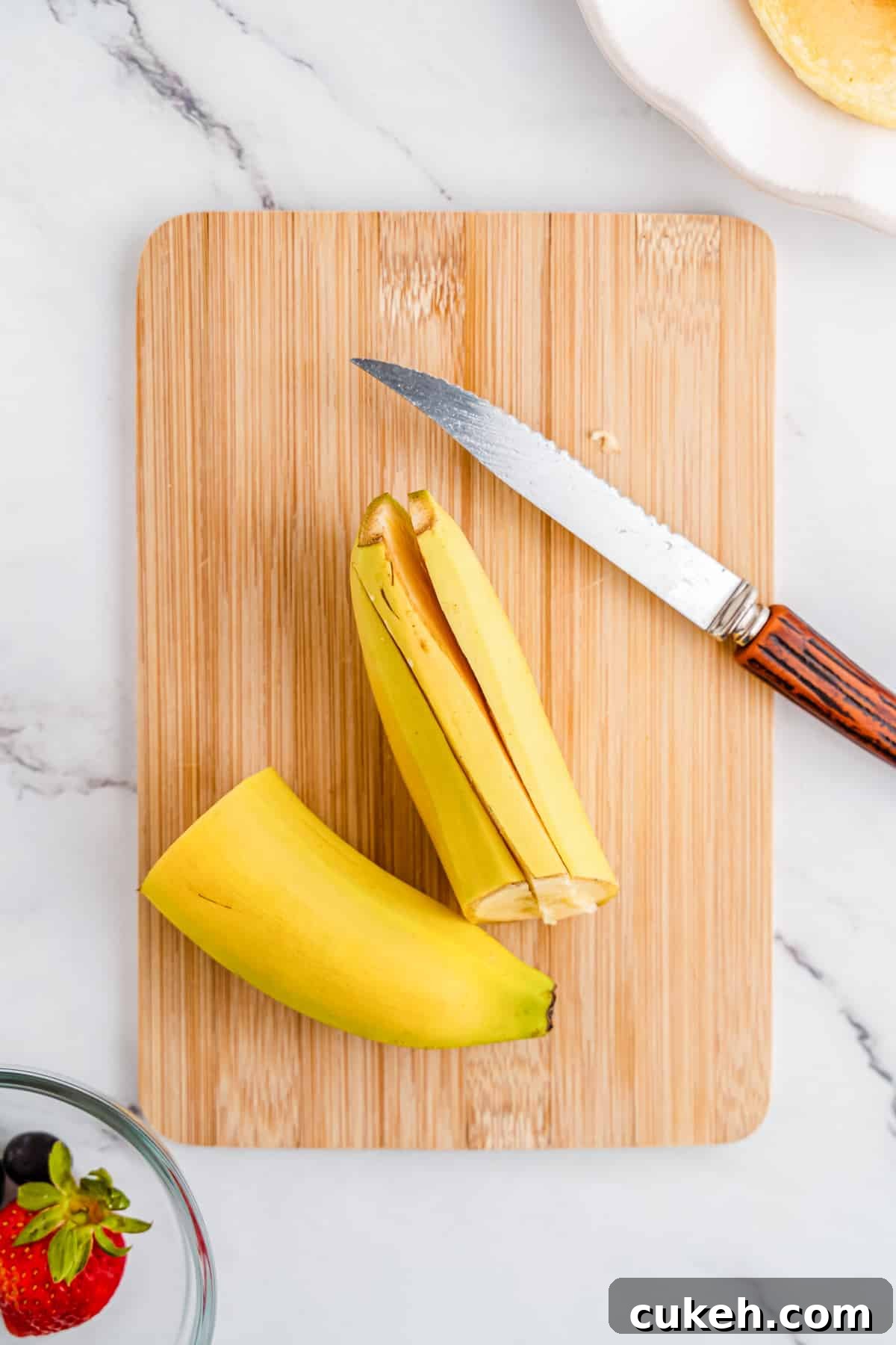 then cut one side of the banana into thirds