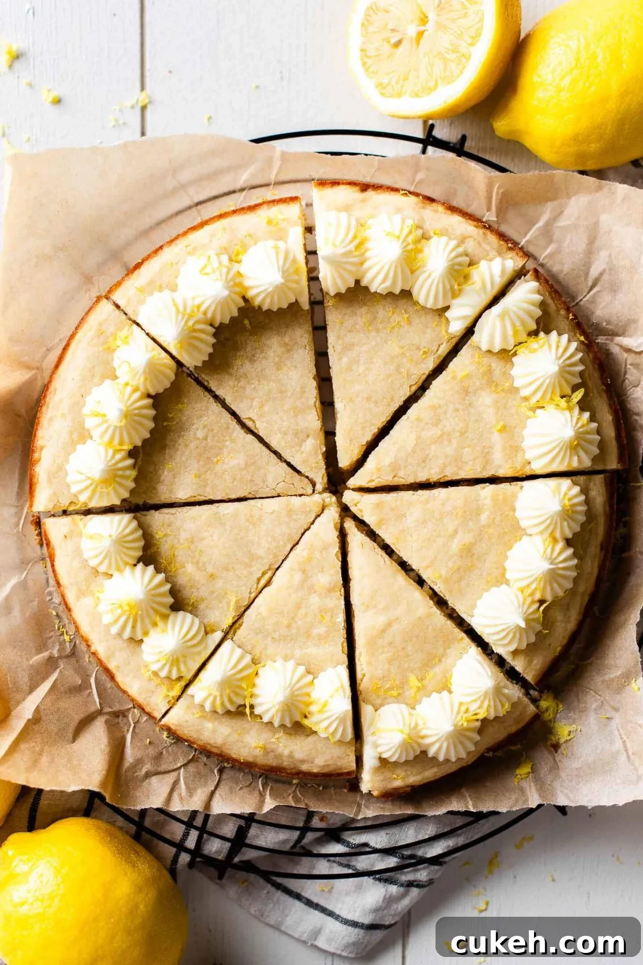 sliced Giant Lemon Cookie Cake on parchment lined wire rack