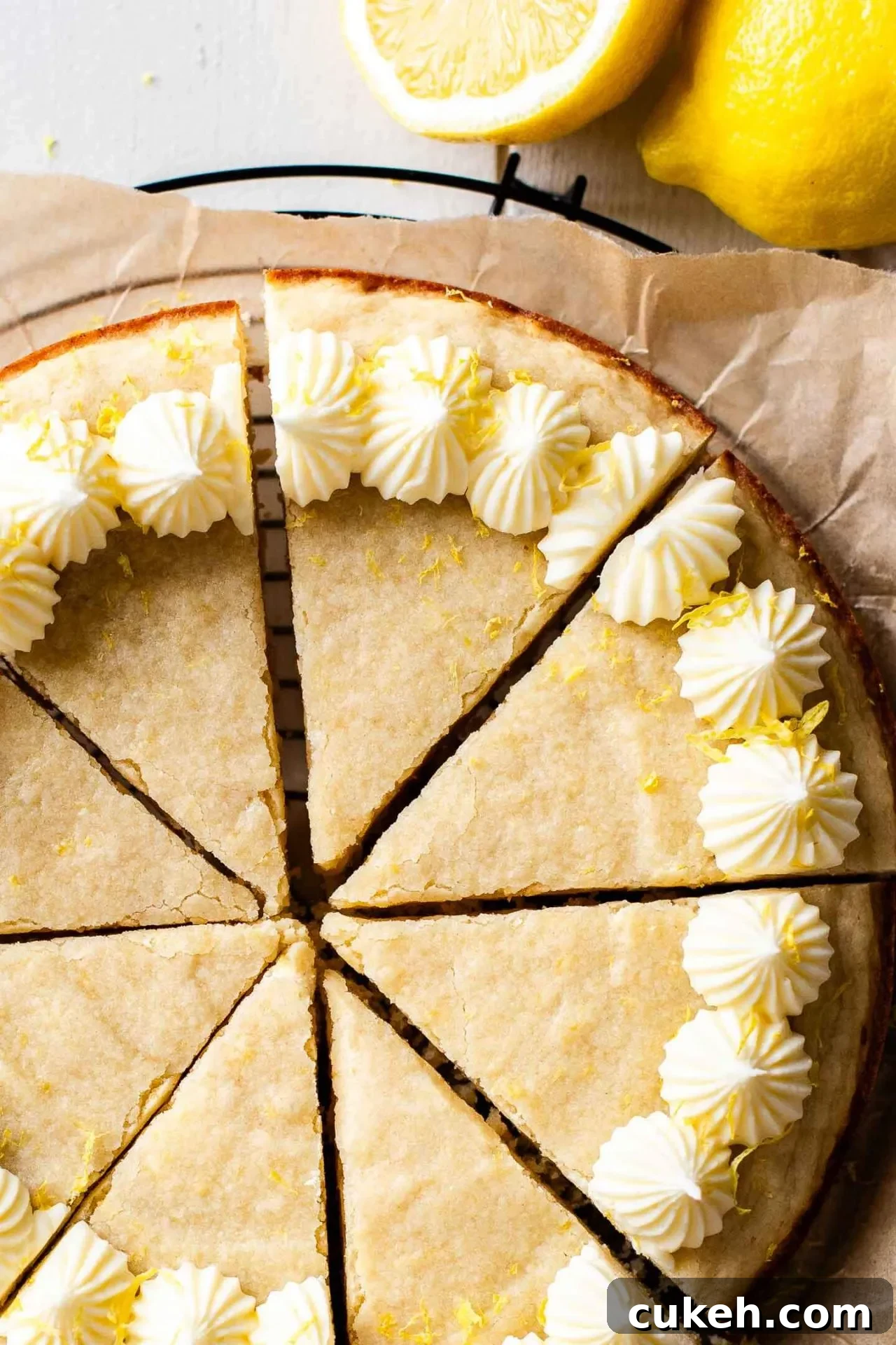 sliced Giant Lemon Cookie Cake on parchment lined wire rack