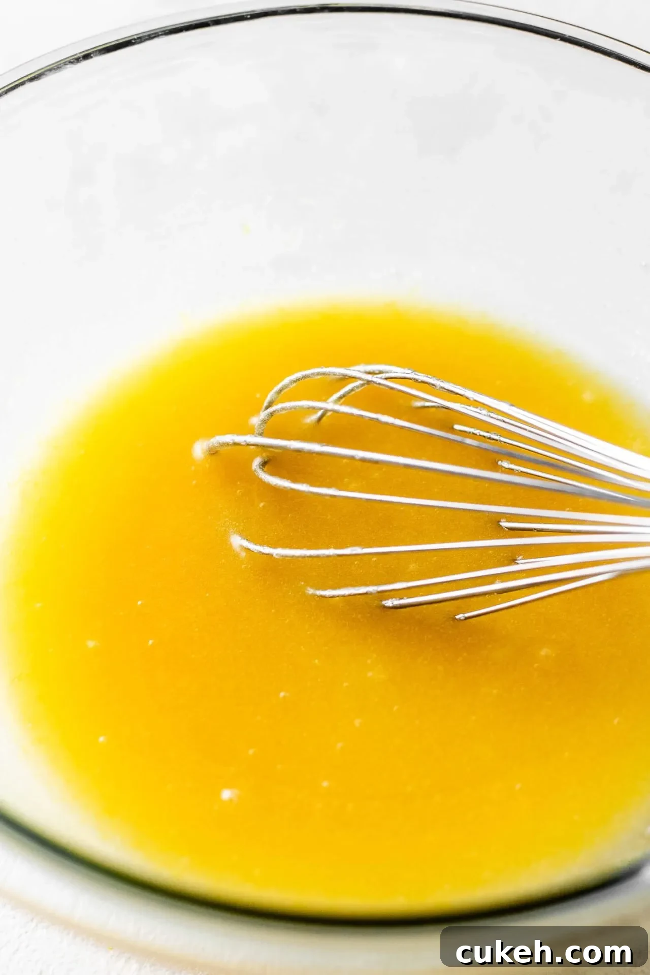 lemon cookie cake wet ingredients whisked together in bowl