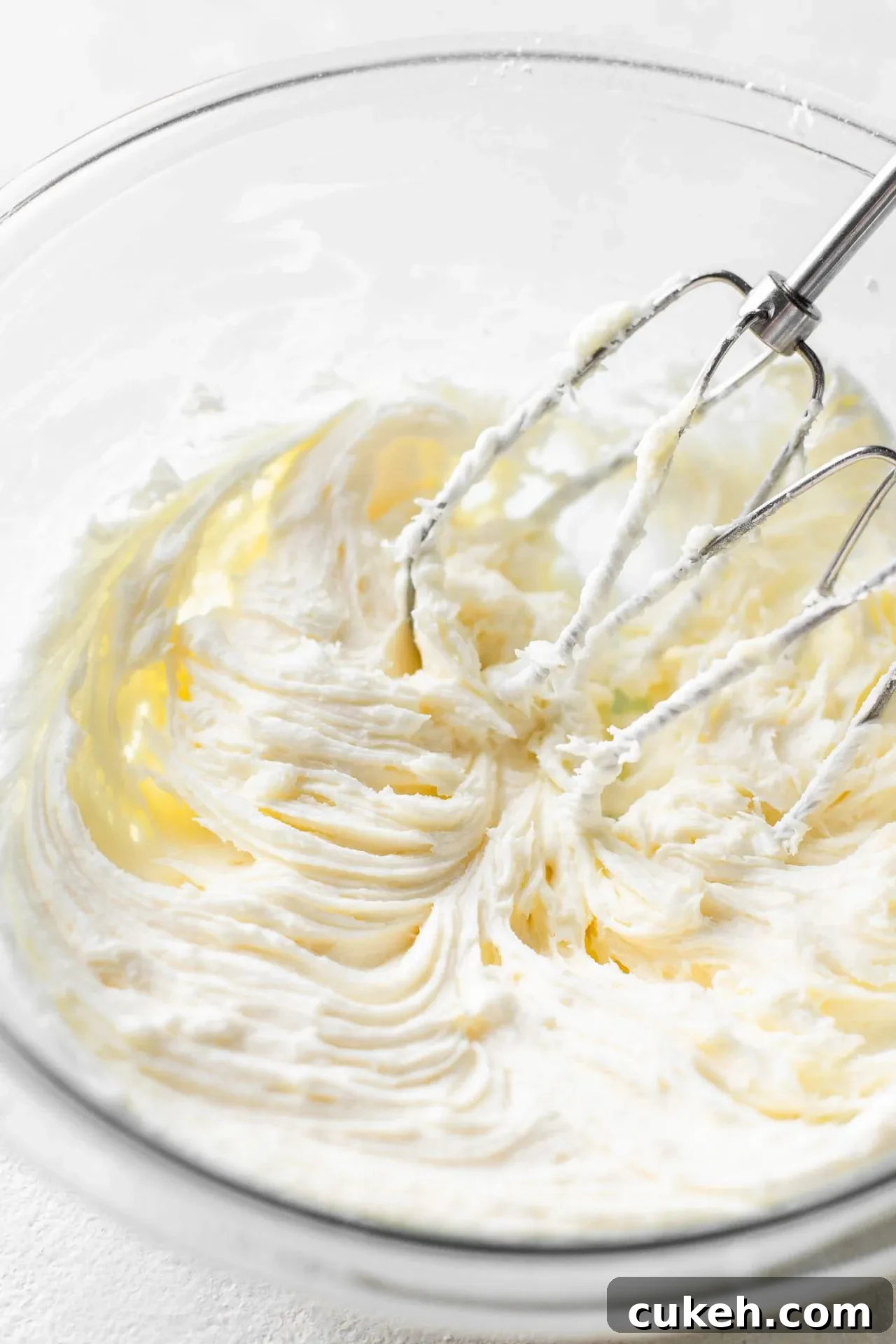cream cheese frosting for lemon cookie cake in bowl