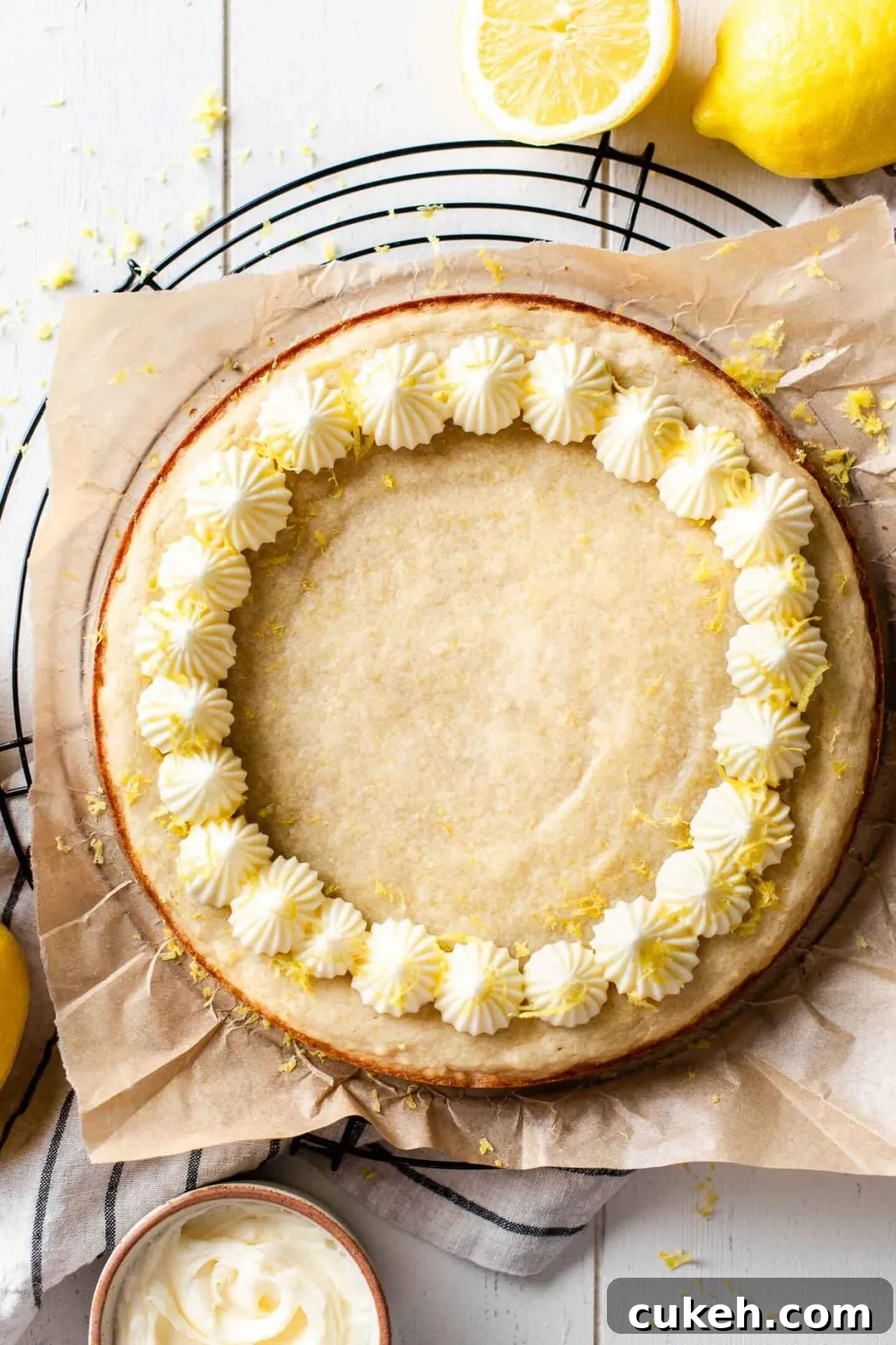 frosted lemon cookie cake on parchment lined wire rack