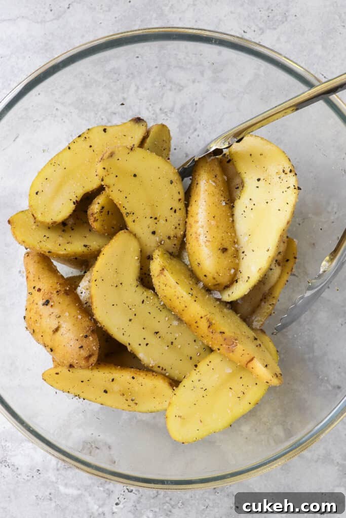 Sliced fingerling potatoes in a bowl.