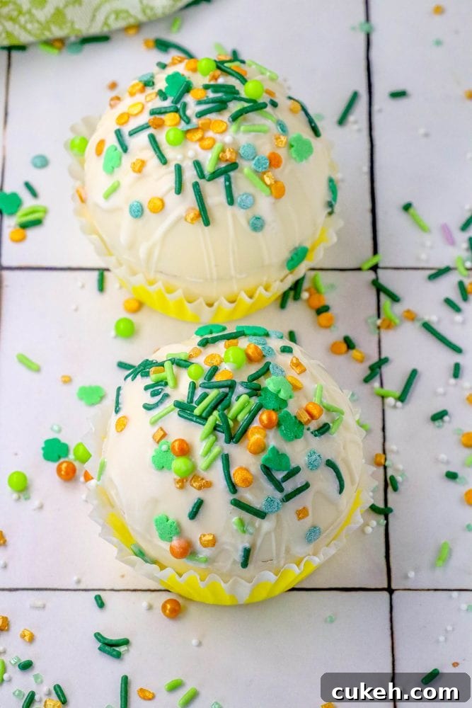Saint Patrick's Day Hot Chocolate Bombs Recipe: Festive Ideas & Tips 6 white chocolate hot chocolate bombs covered in saint patricks day sprinkles on a table