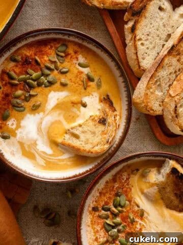 two bowls of sweet potato pumpkin soup.