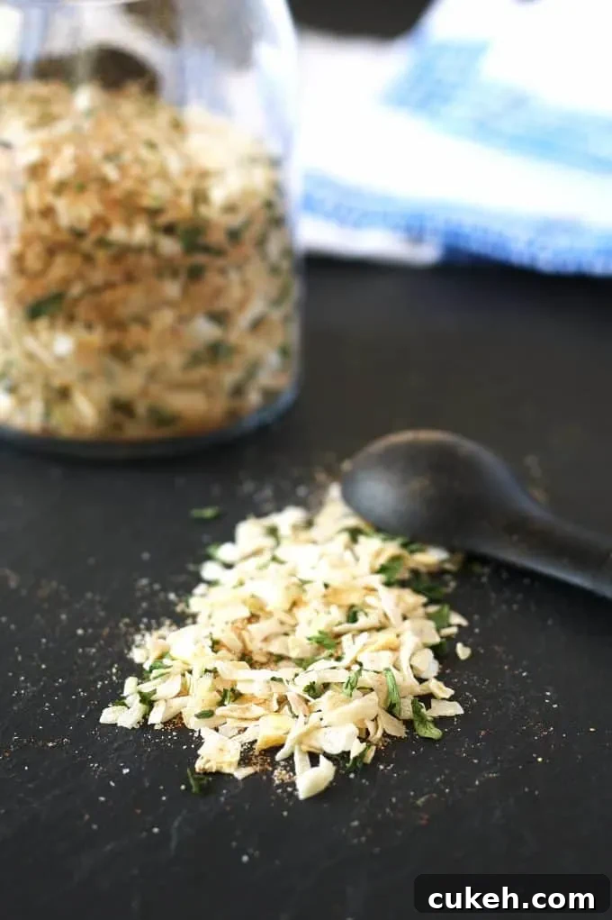 onion soup mix on a black board with a teaspoon