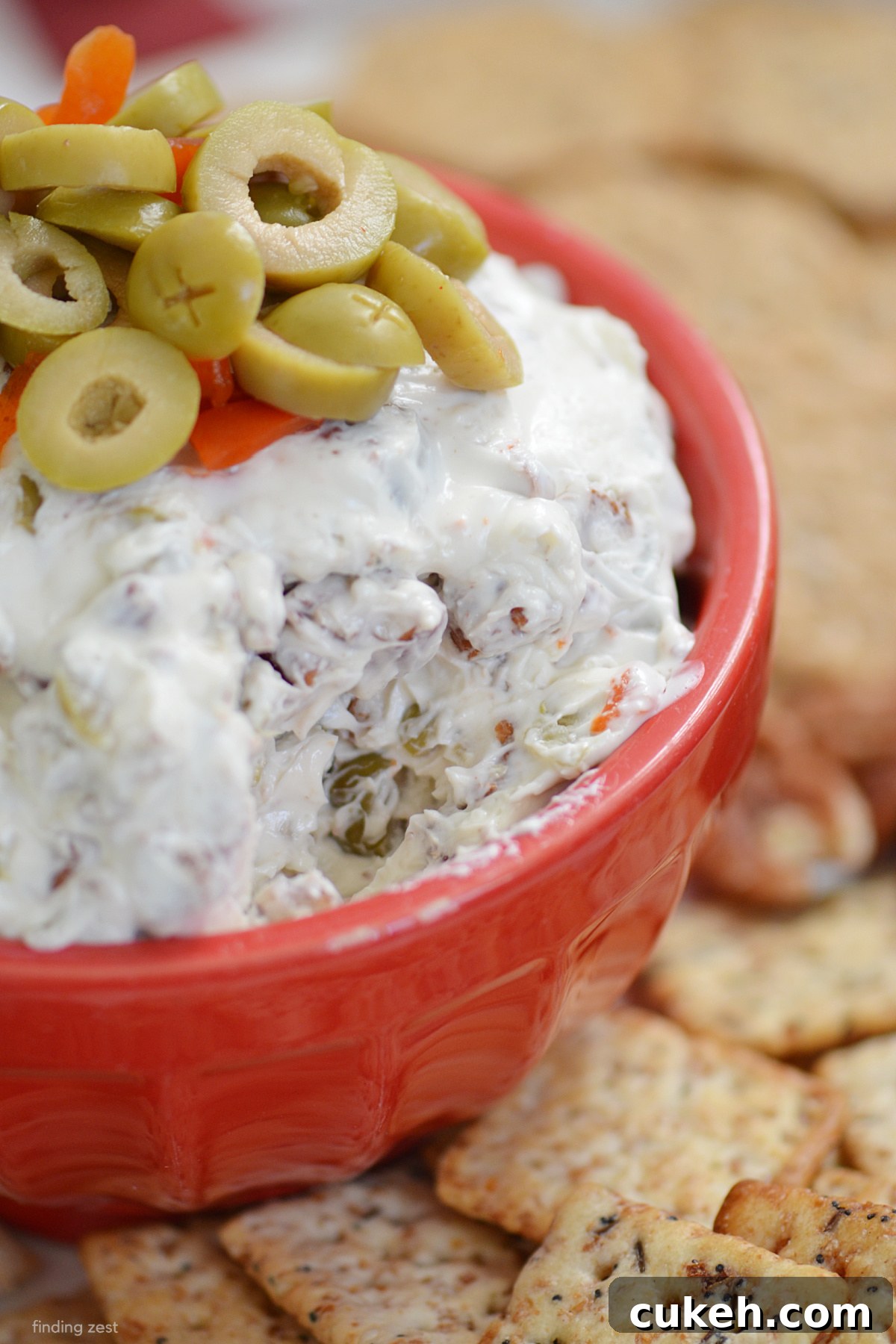 This olive dip recipe is the stuff of dreams for olive lovers! Serve this easy dip recipe with just four ingredients at your next holiday gathering, party or game day celebration!