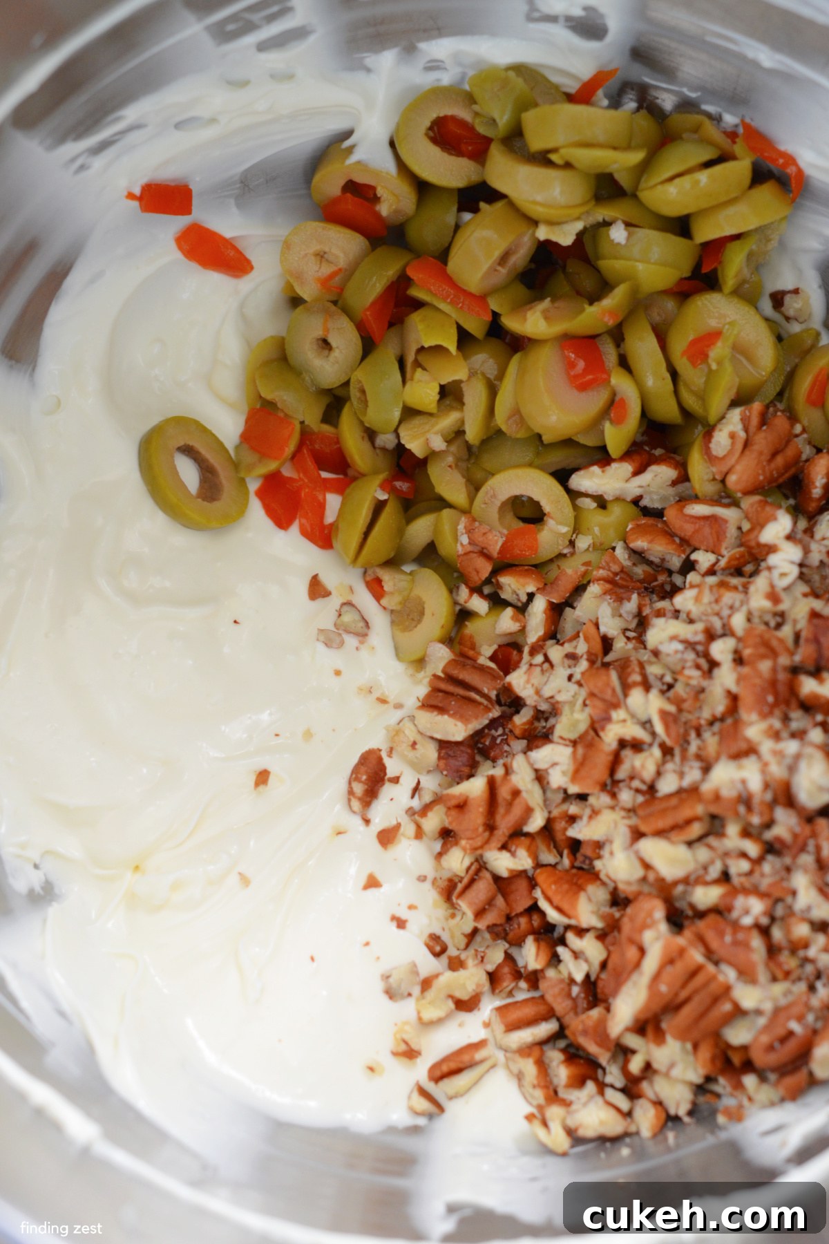 Sliced green olives, cream cheese, mayo and pecans for a dip recipe