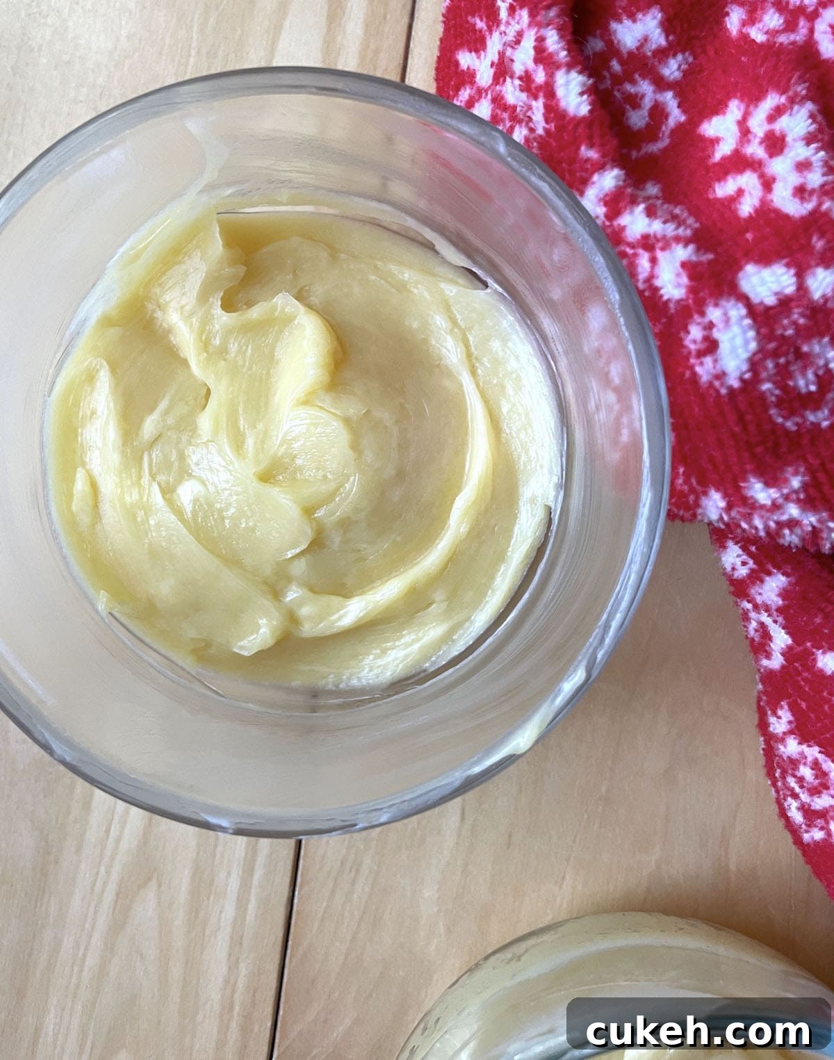 A small bowl of honey butter ready to be stored in the fridge.