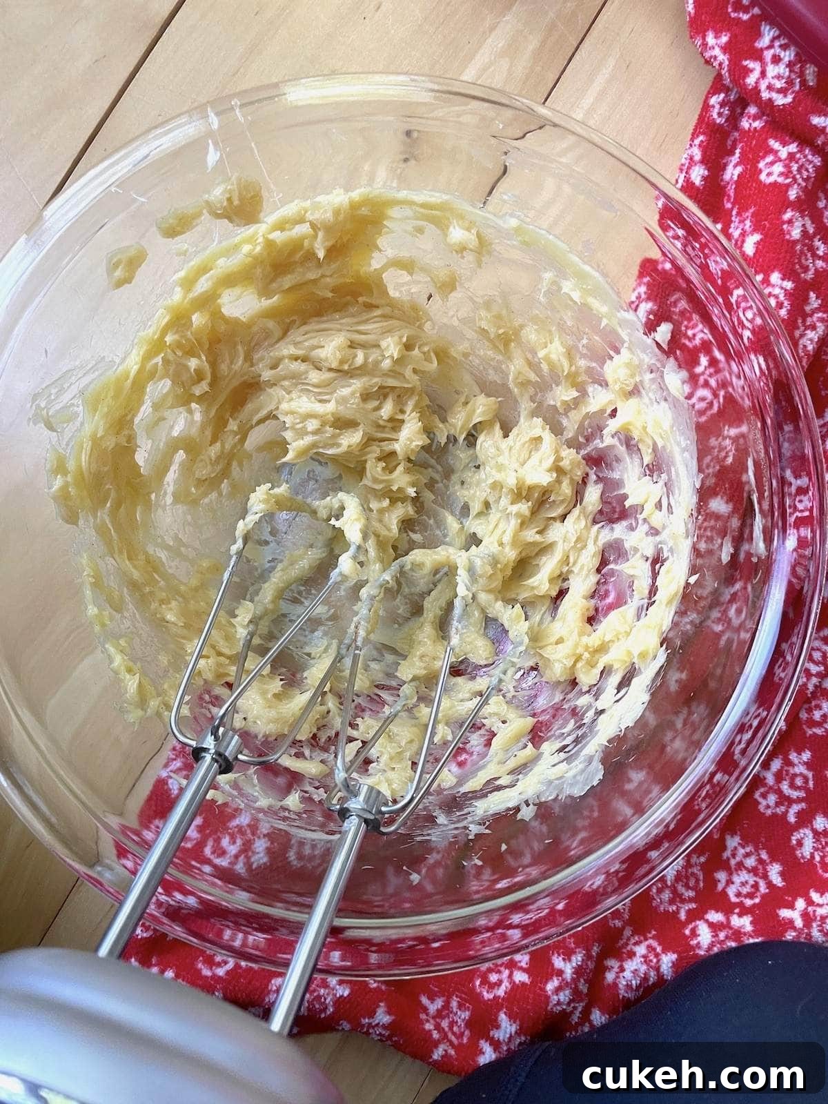 Vanilla cinnamon honey butter in a mixing bowl after being whipped with a hand mixer.