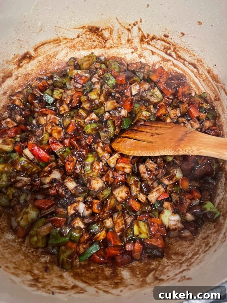 overhead shot of roux with chopped vegetables added for gumbo