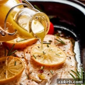 Champagne vinaigrette flowing from a bottle onto cooked fish for simple seasoning.