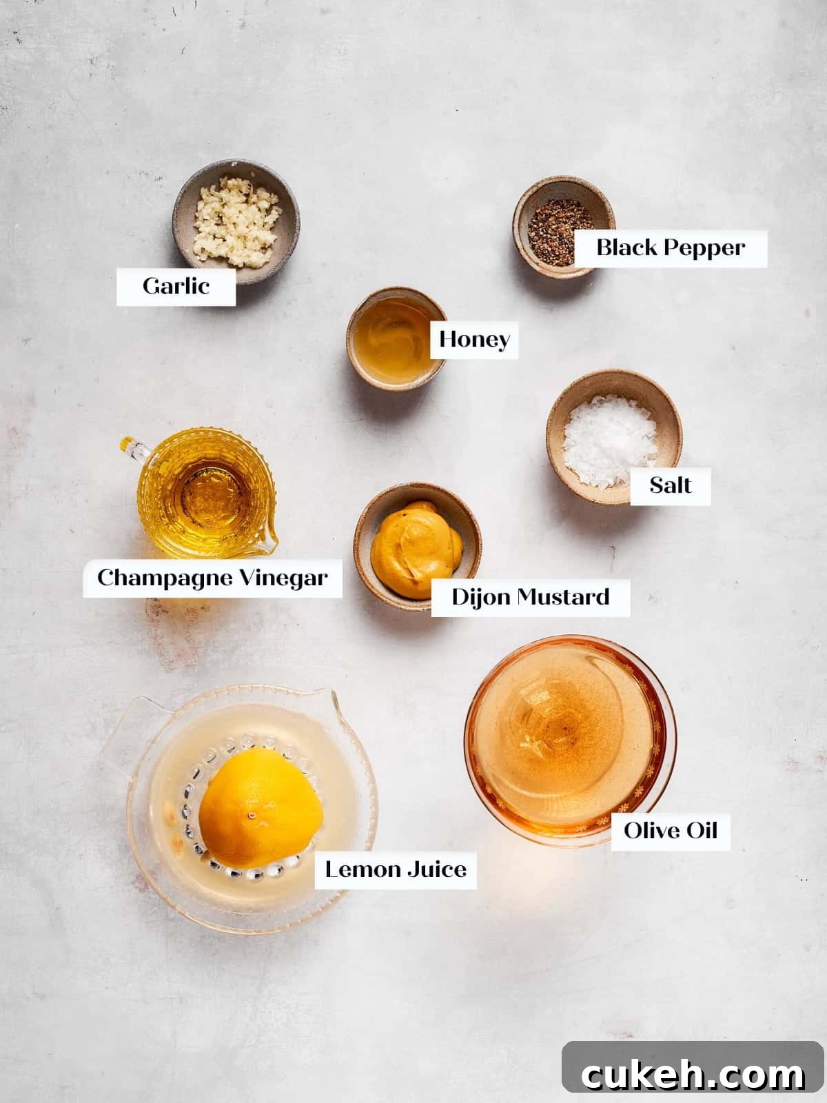 Simple ingredients laid out for making champagne vinaigrette at home.