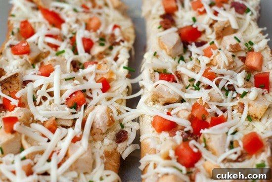 Delicious Garlic Bread Pizza with mozzarella, tomatoes and chicken.