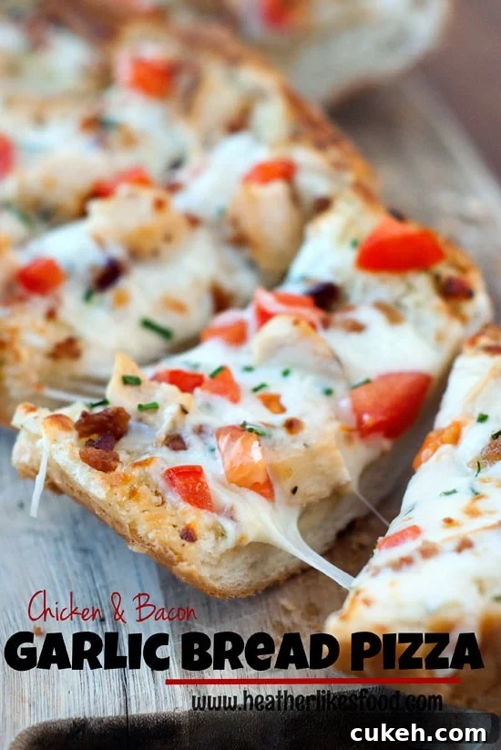 Easy Chicken and Bacon Garlic Bread Pizza being split apart on a wooden board.