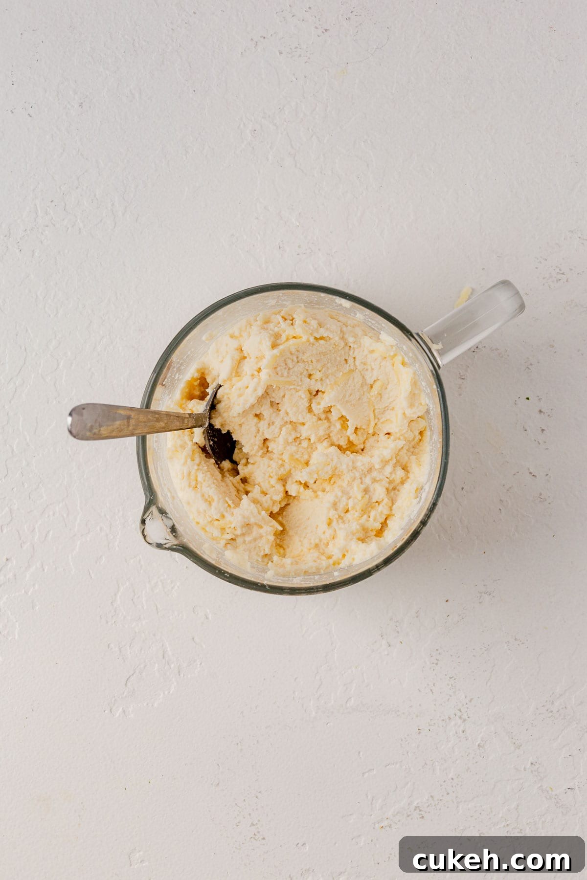 ricotta, mozzarella cheese, and parmesan cheese mixed in a bowl.