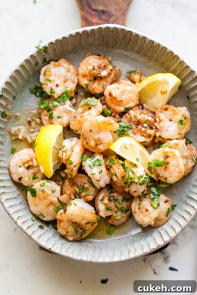 Garlic Butter Shrimp In a Dish with parsley and lemon