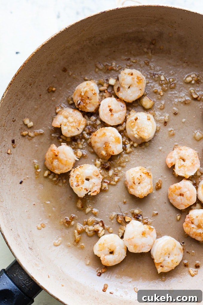 Shrimp in a pan with garlic and chilli.
