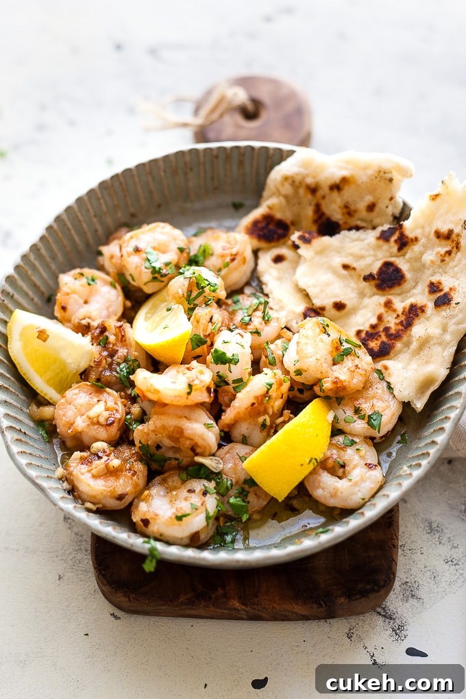 Garlic Butter Shrimp In a Dish with parsley and lemon