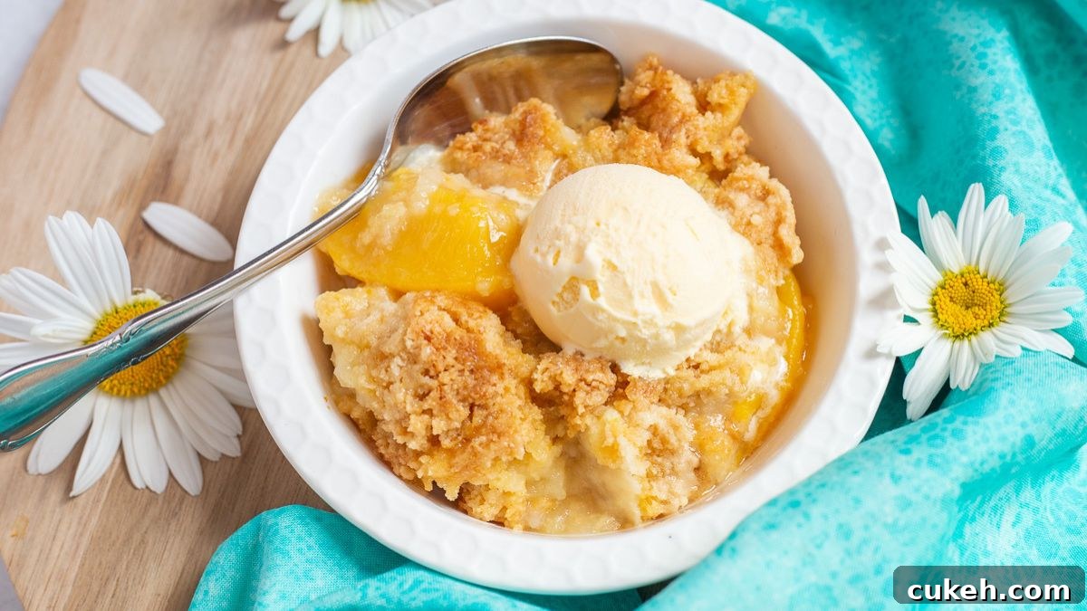 Peach cobbler with cake mix in a white bowl.
