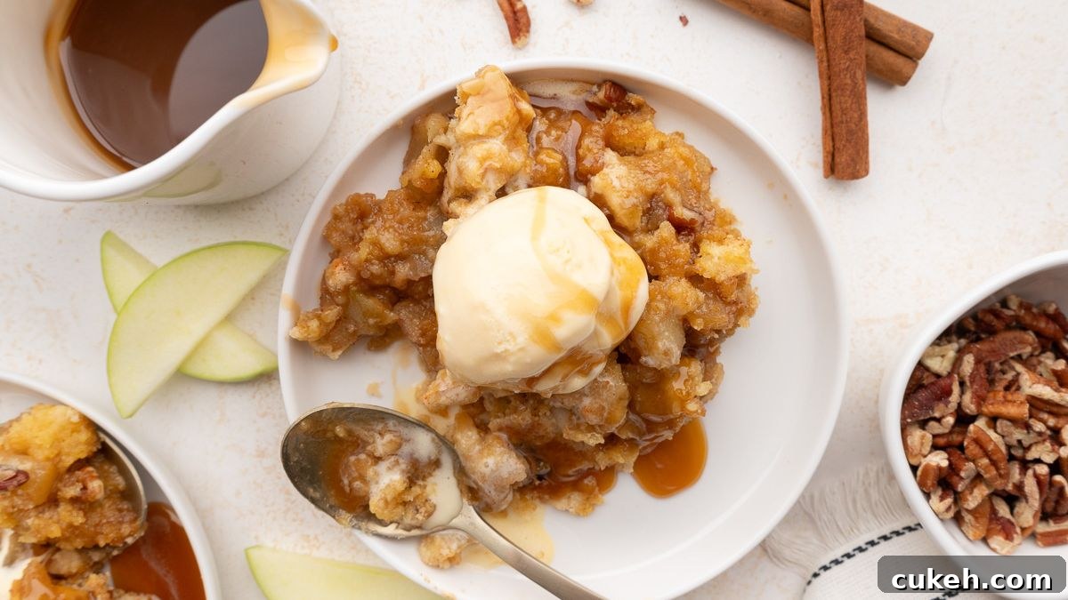 Caramel apple dump cake on a white plate.