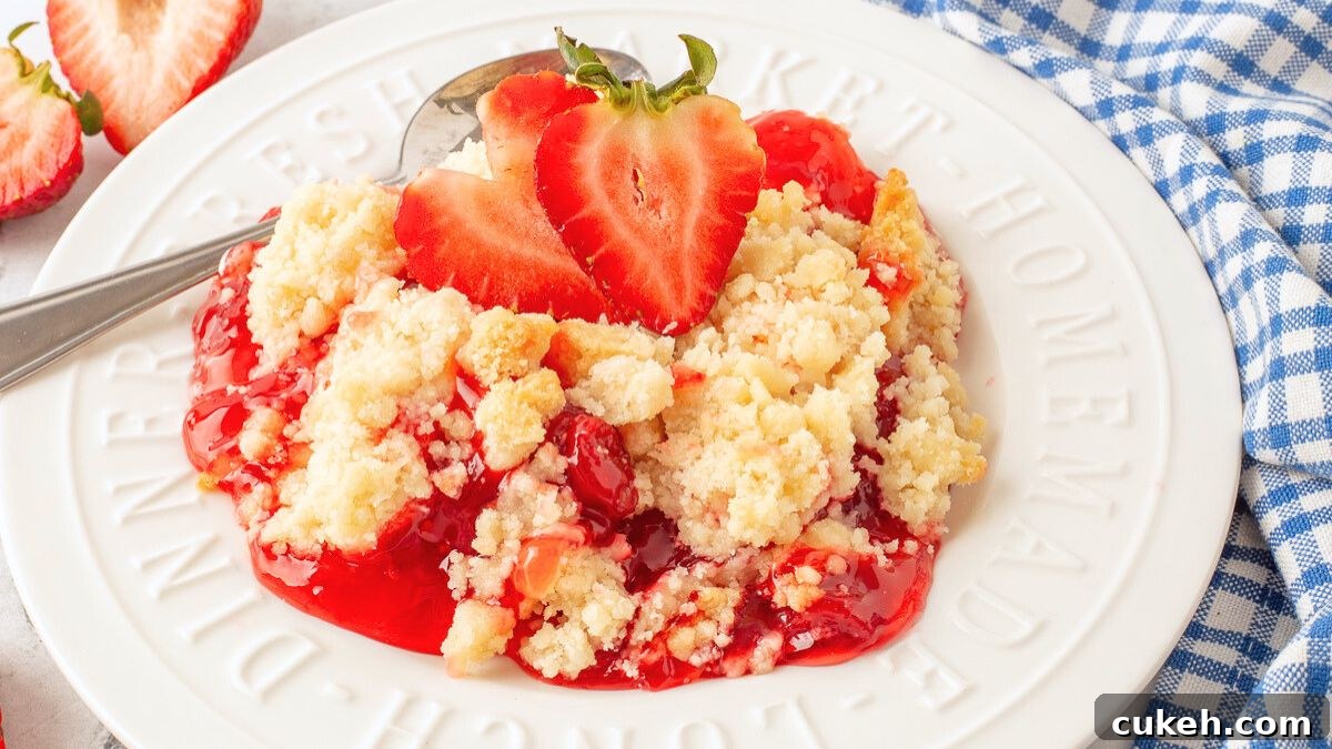 Strawberry cheesecake dump cake on a white plate.