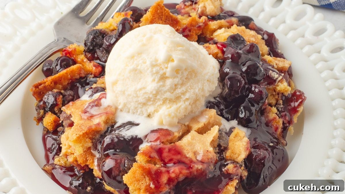 Blueberry dump cake on a white plate.