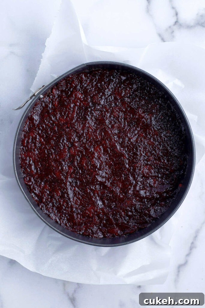 cranberry orange layer over cookie crust in a springform pan