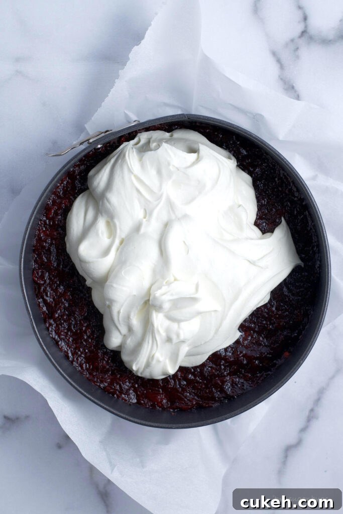 white chocolate mousse over cranberry filling
