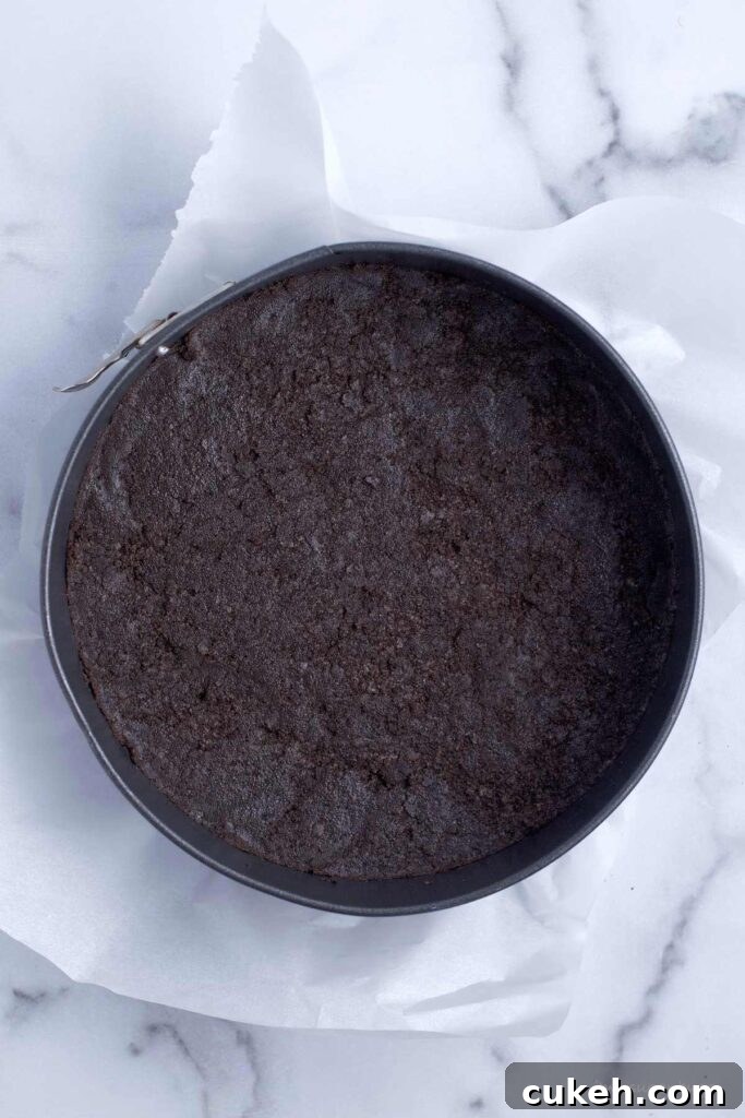 chocolate cookie crust pressed in a springform pan