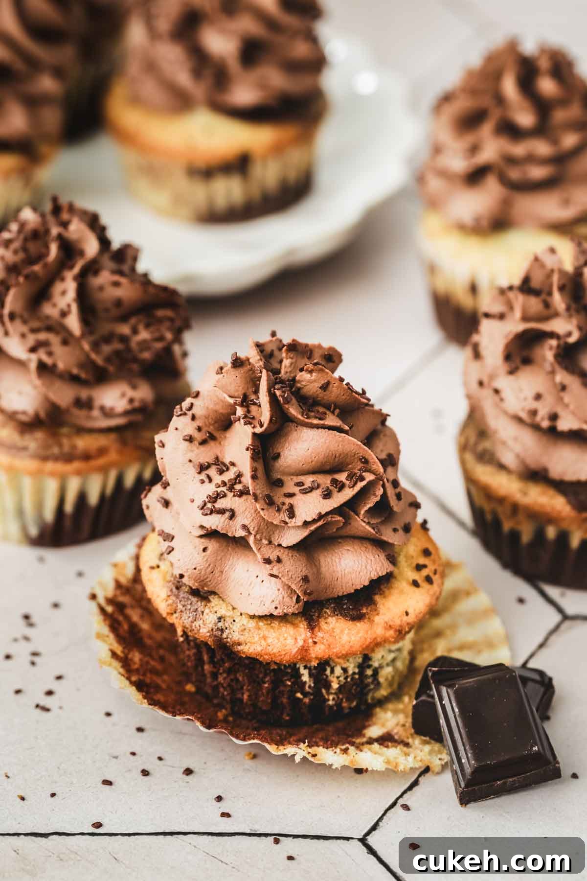 Marble Cupcakes Recipe: Swirled Chocolate-Vanilla Cupcakes 2 marble cupcakes on a table