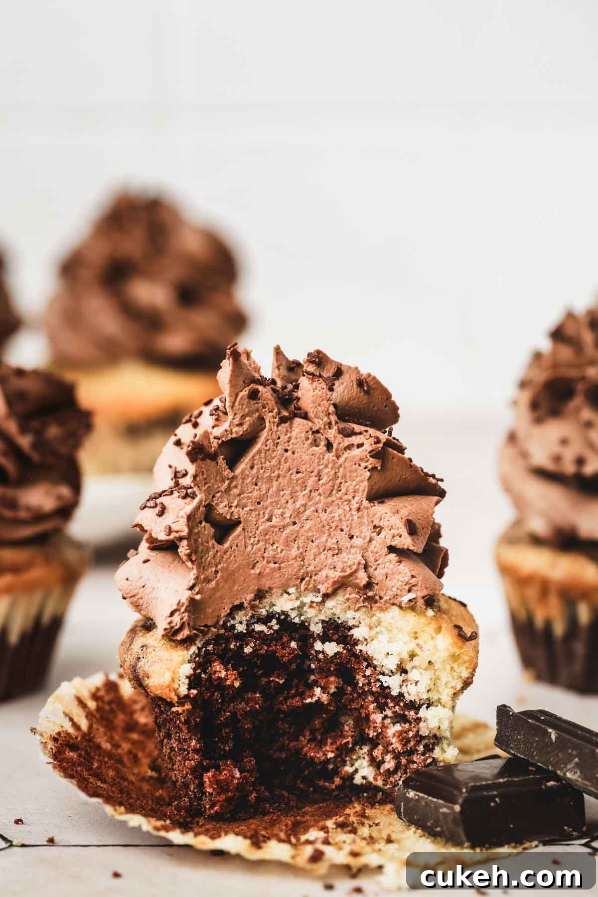 Marble Cupcakes Recipe: Swirled Chocolate-Vanilla Cupcakes 13 sliced chocolate marble cupcake showing moist crumb