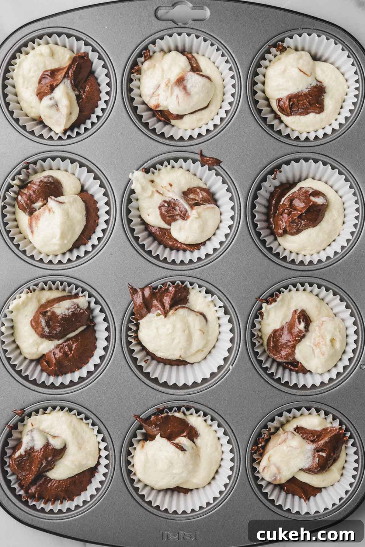 Marble Cupcakes Recipe: Swirled Chocolate-Vanilla Cupcakes 7 cupcake pan filled with marble cupcake batter