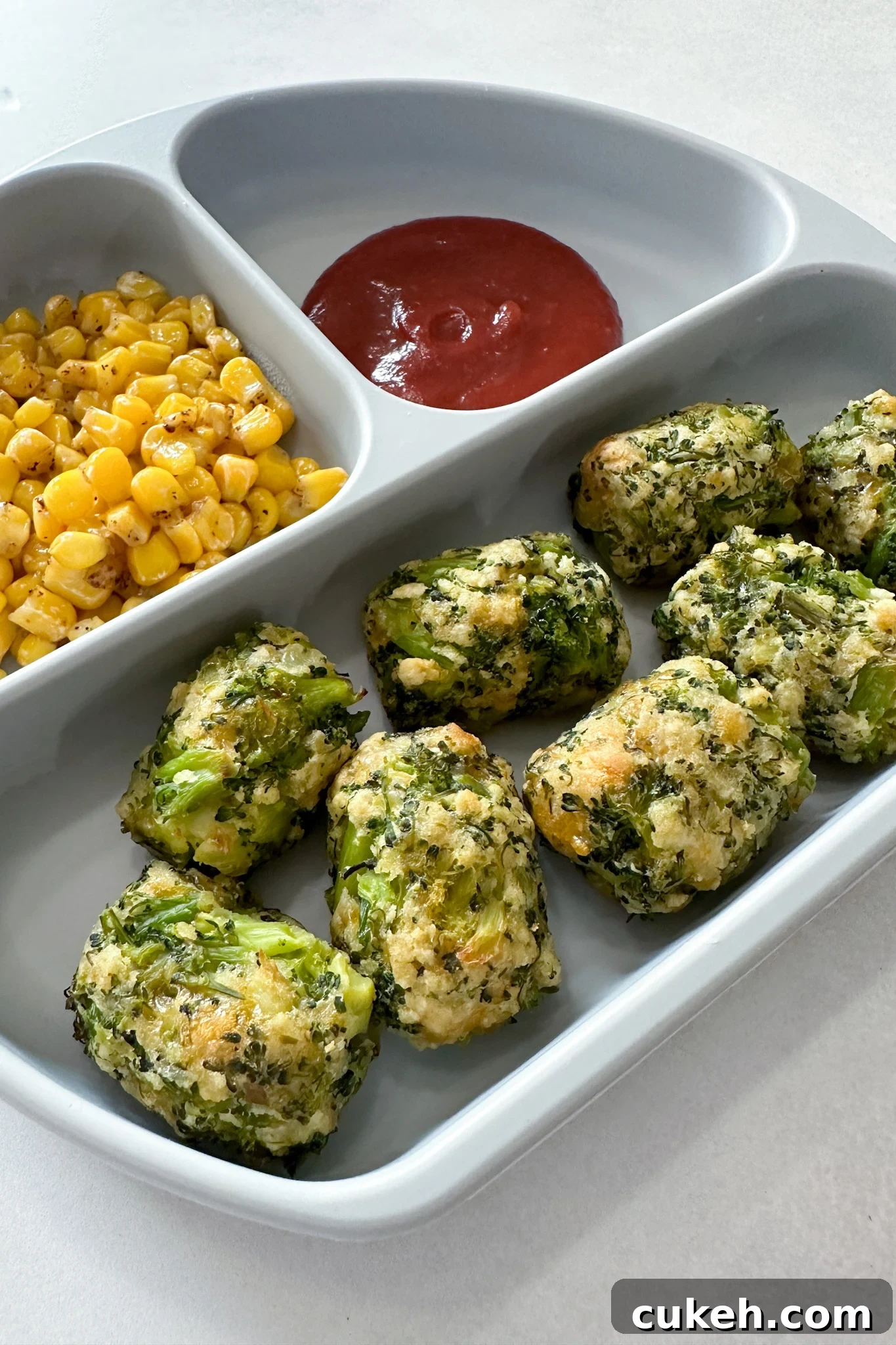 15 Nutritious Broccoli Recipes for Babies and Toddlers 13 Broccoli tots served with corn and ketchup.