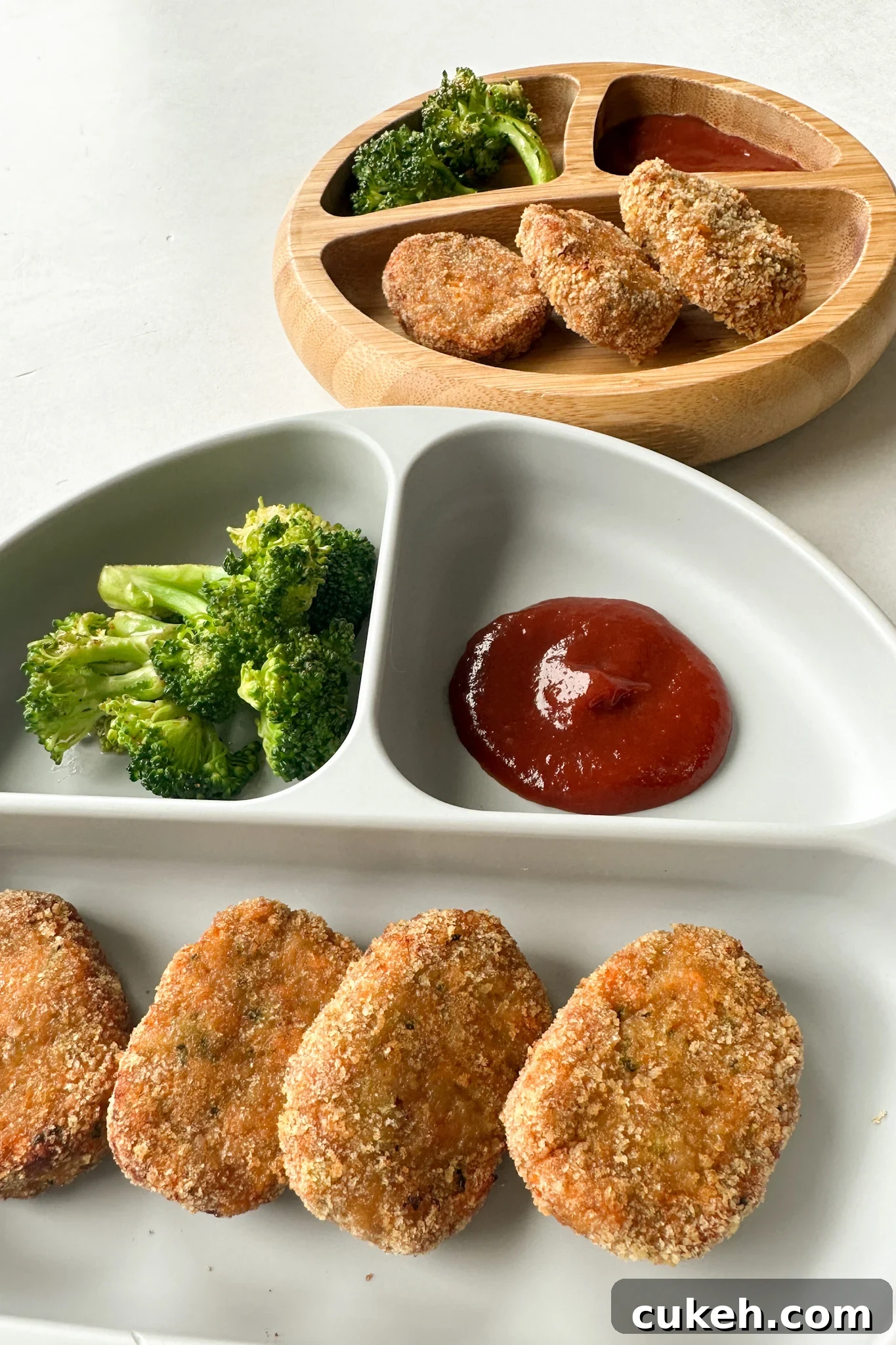 15 Nutritious Broccoli Recipes for Babies and Toddlers 19 Veggie chicken nuggets served with broccoli and ketchup.