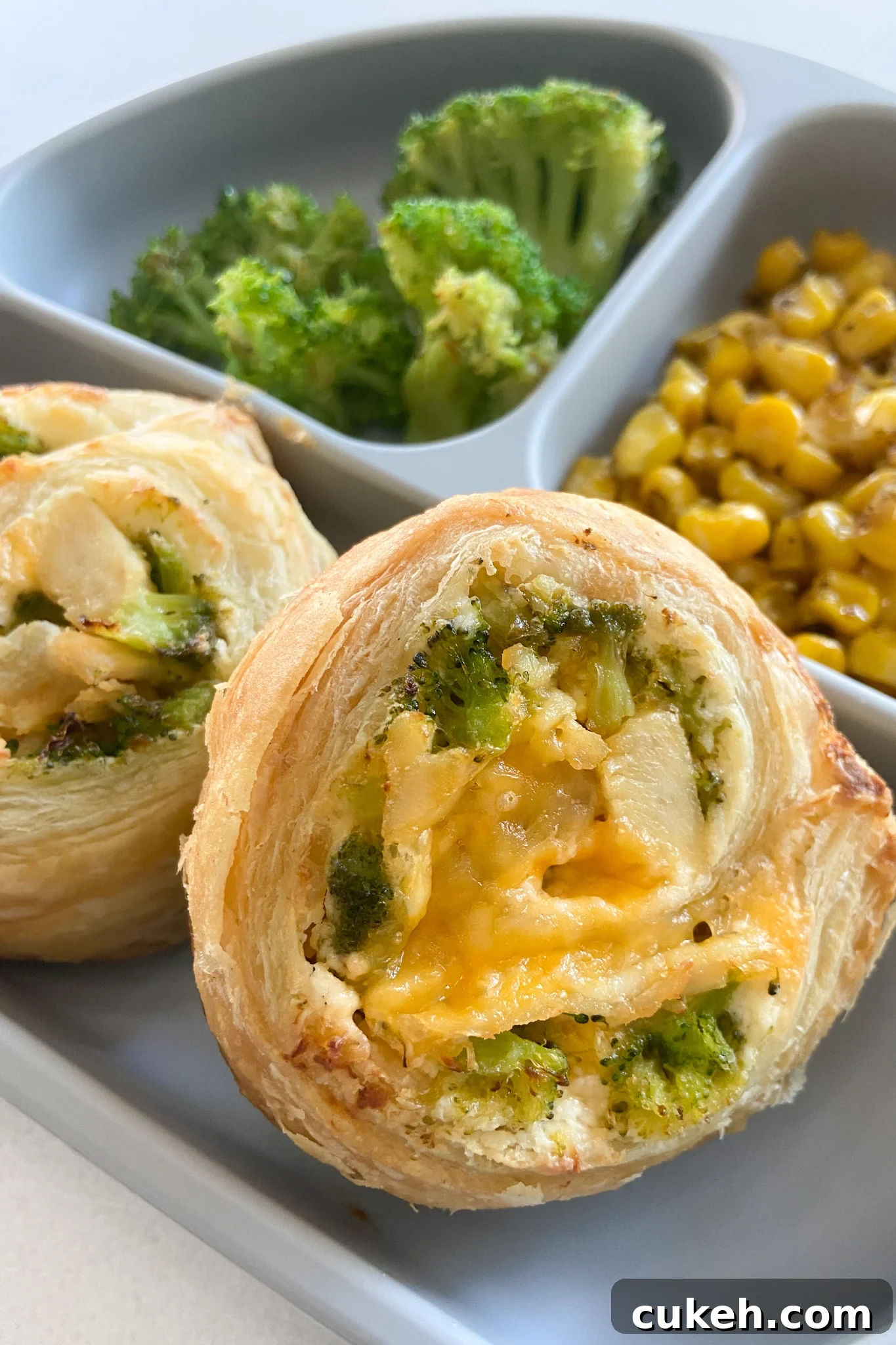 15 Nutritious Broccoli Recipes for Babies and Toddlers 5 Broccoli and cheese pinwheels served with broccoli and roasted corn.