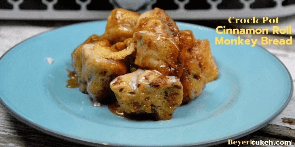 Crock Pot Cinnamon Roll Monkey Bread combines two tubes of refrigerator cinnamon rolls with caramel sauce that becomes a gooey cinnamon pull-apart bread that is drowned in icing to finish it off.