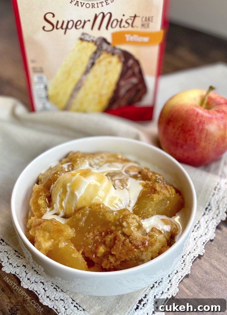 Quick and Easy Caramel Apple Cobbler Dump Cake made with pie filling and boxed yellow cake mix. Serve with vanilla ice cream.