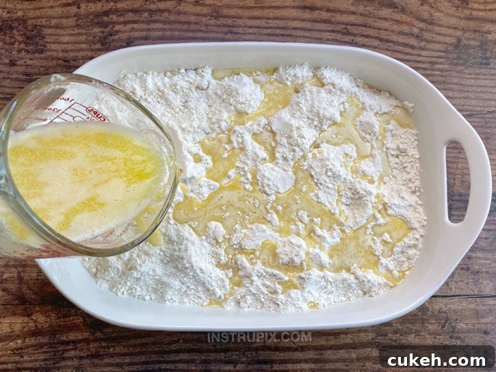 Pour melted butter over the cake mix.