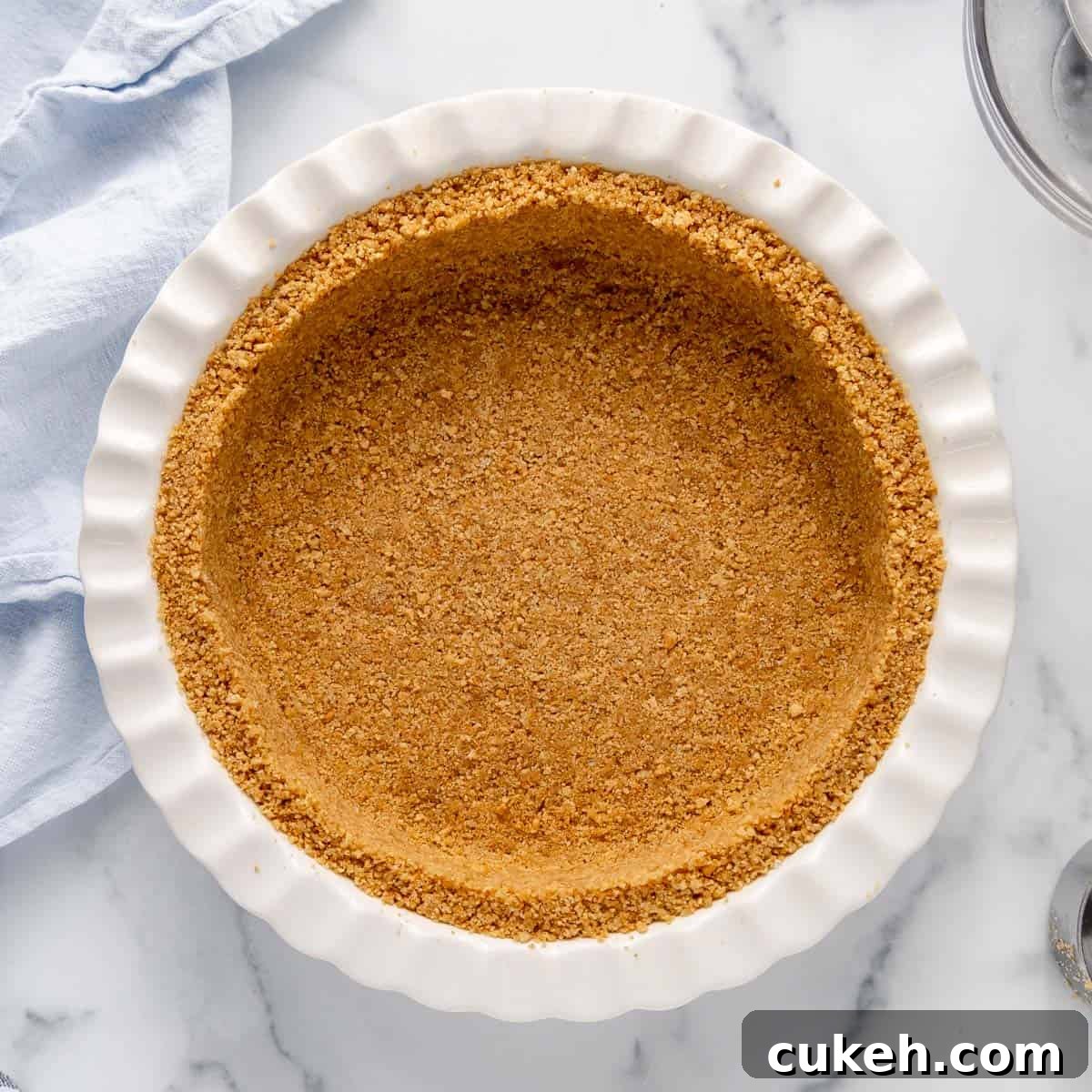 Overhead photo of a baked graham cracker crust.