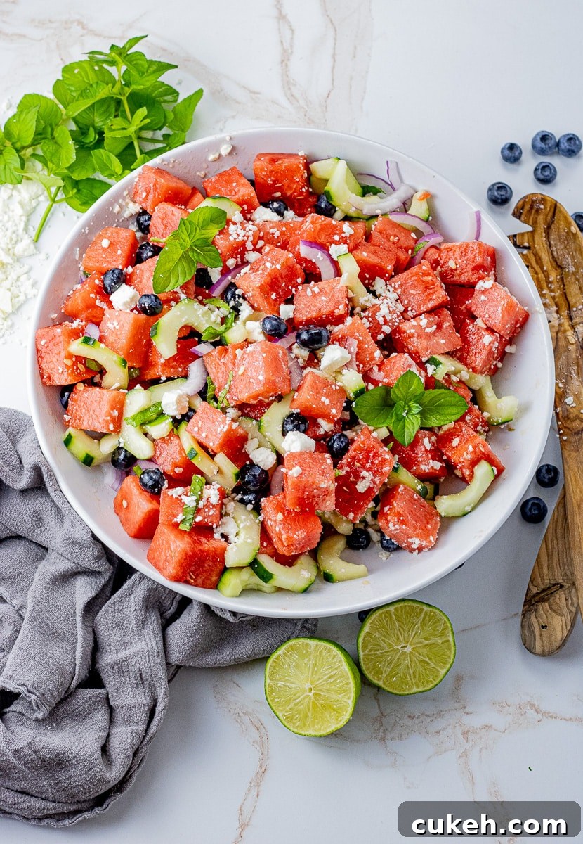 Refreshing Watermelon and Feta Salad with Mint and Balsamic 7 watermelon cubes with blueberries, feta cheese and cucumbers