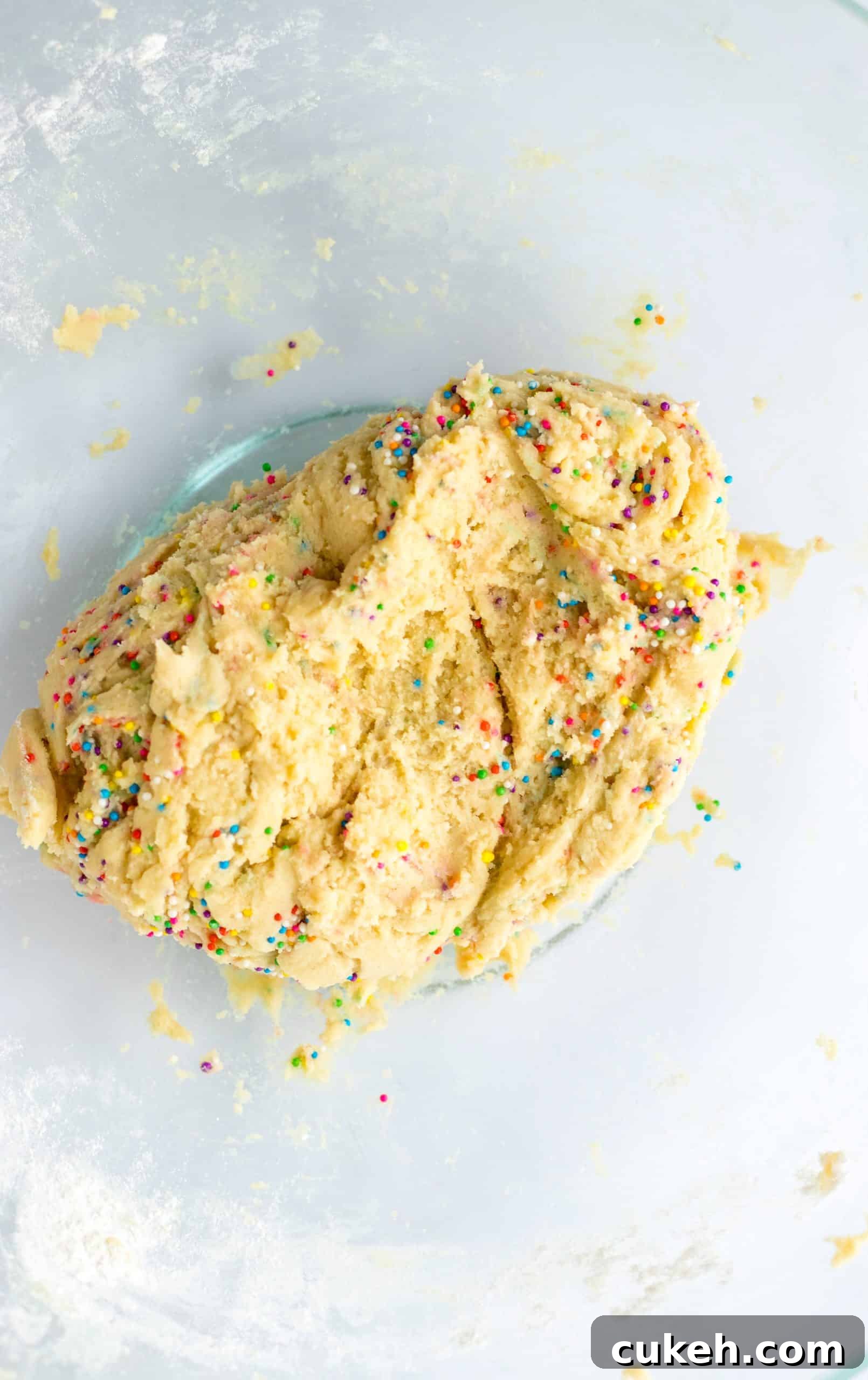 circus animal cookie dough in a glass mixing bowl